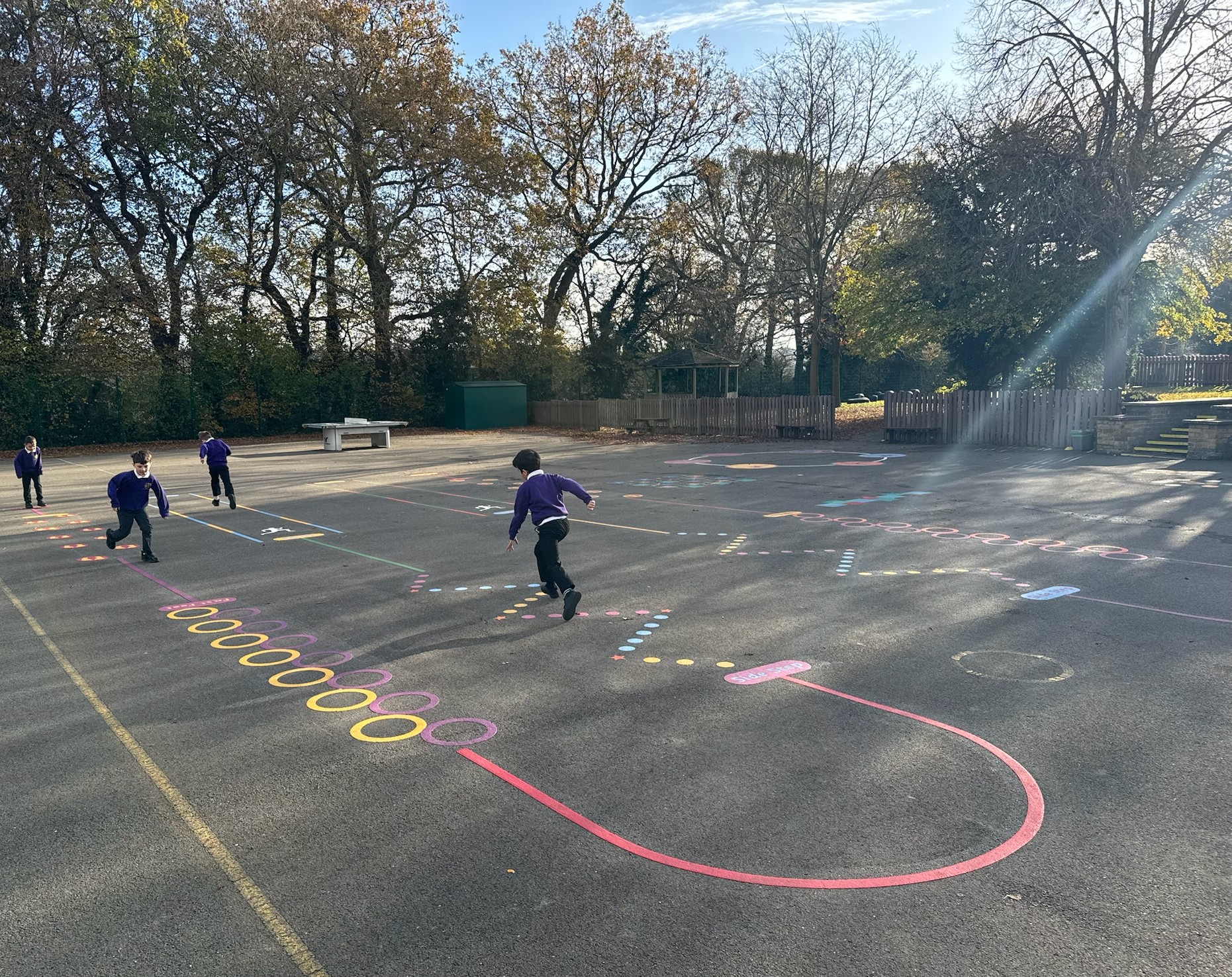 Children playing with playground markings