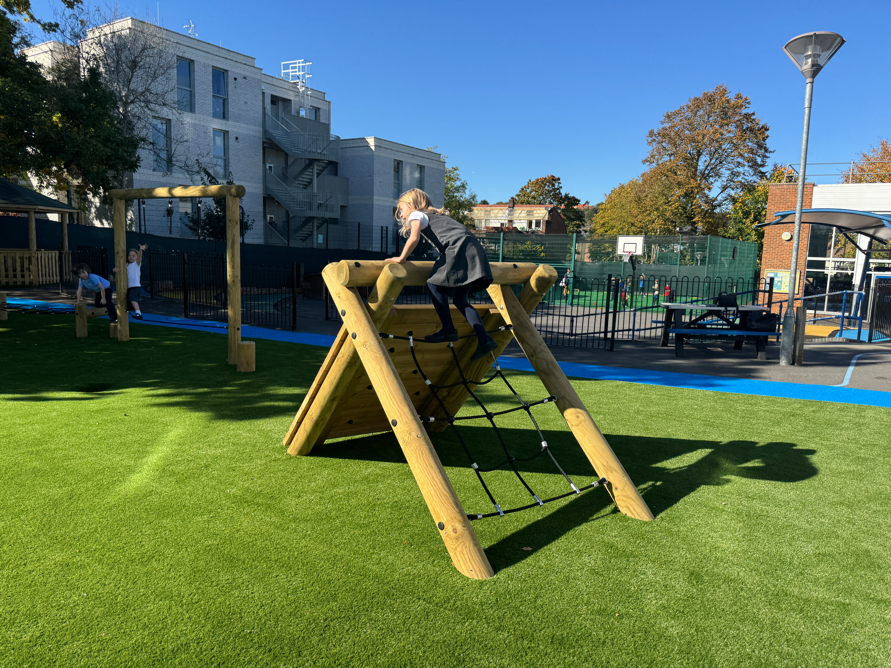 Play Grass beneath trim trail school playground equipment