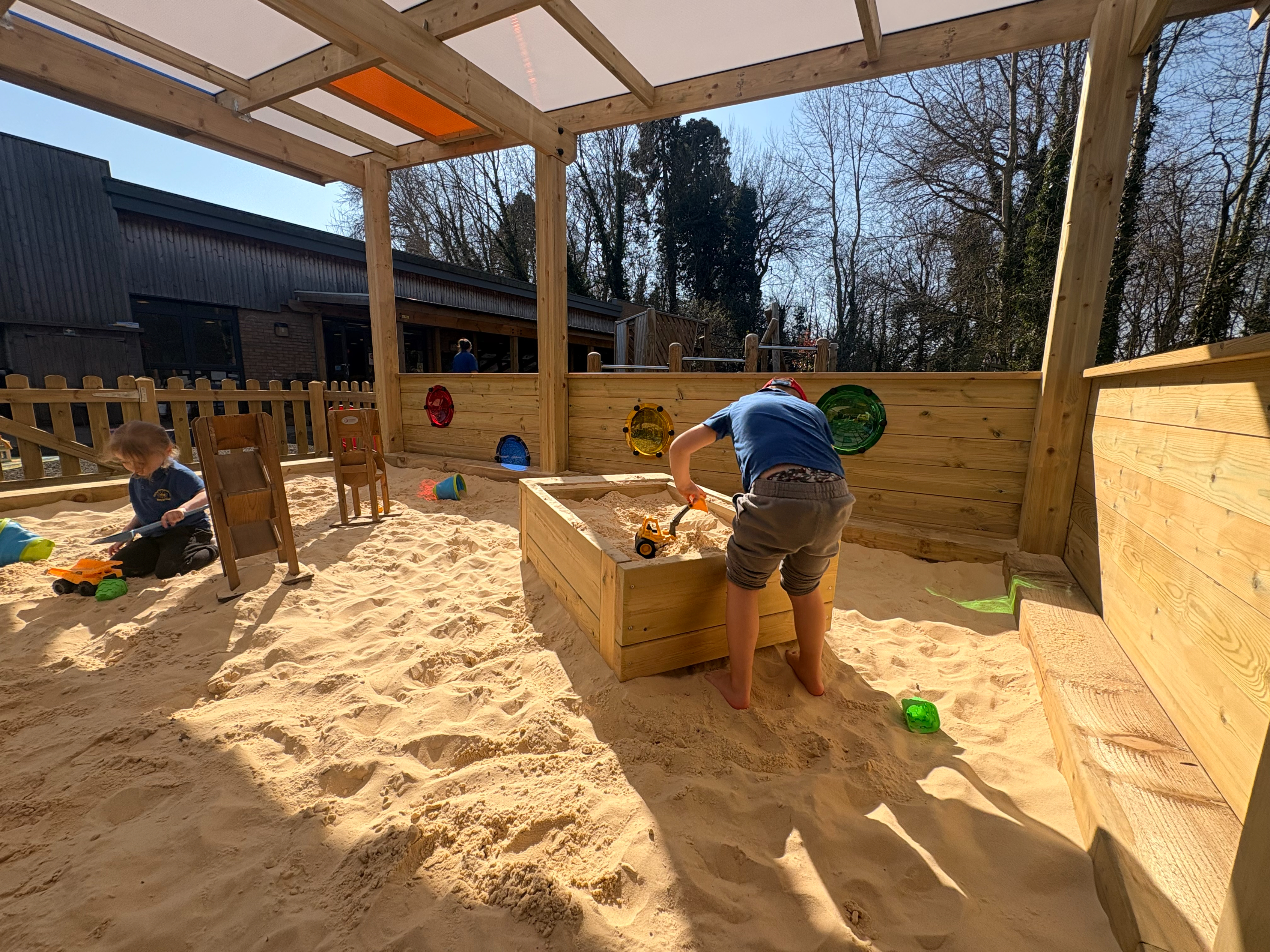 Canopy with Coloured Roof Panels covering Sand Play environment: Orton Longueville Playgroup
