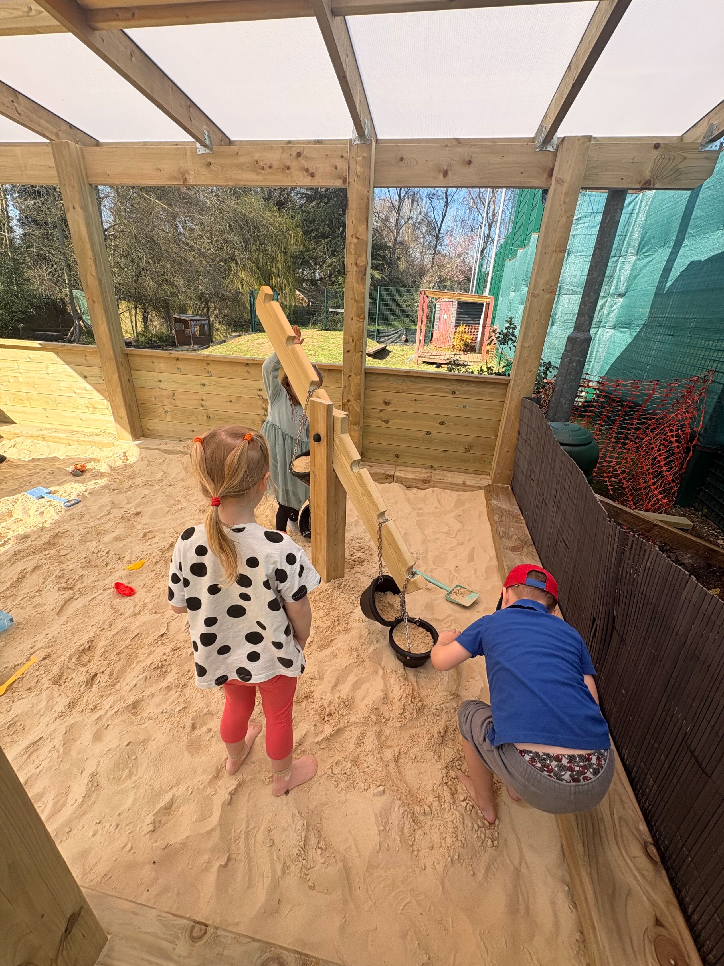 Canopy with Coloured Roof Panels covering Sand Play environment: Orton Longueville Playgroup