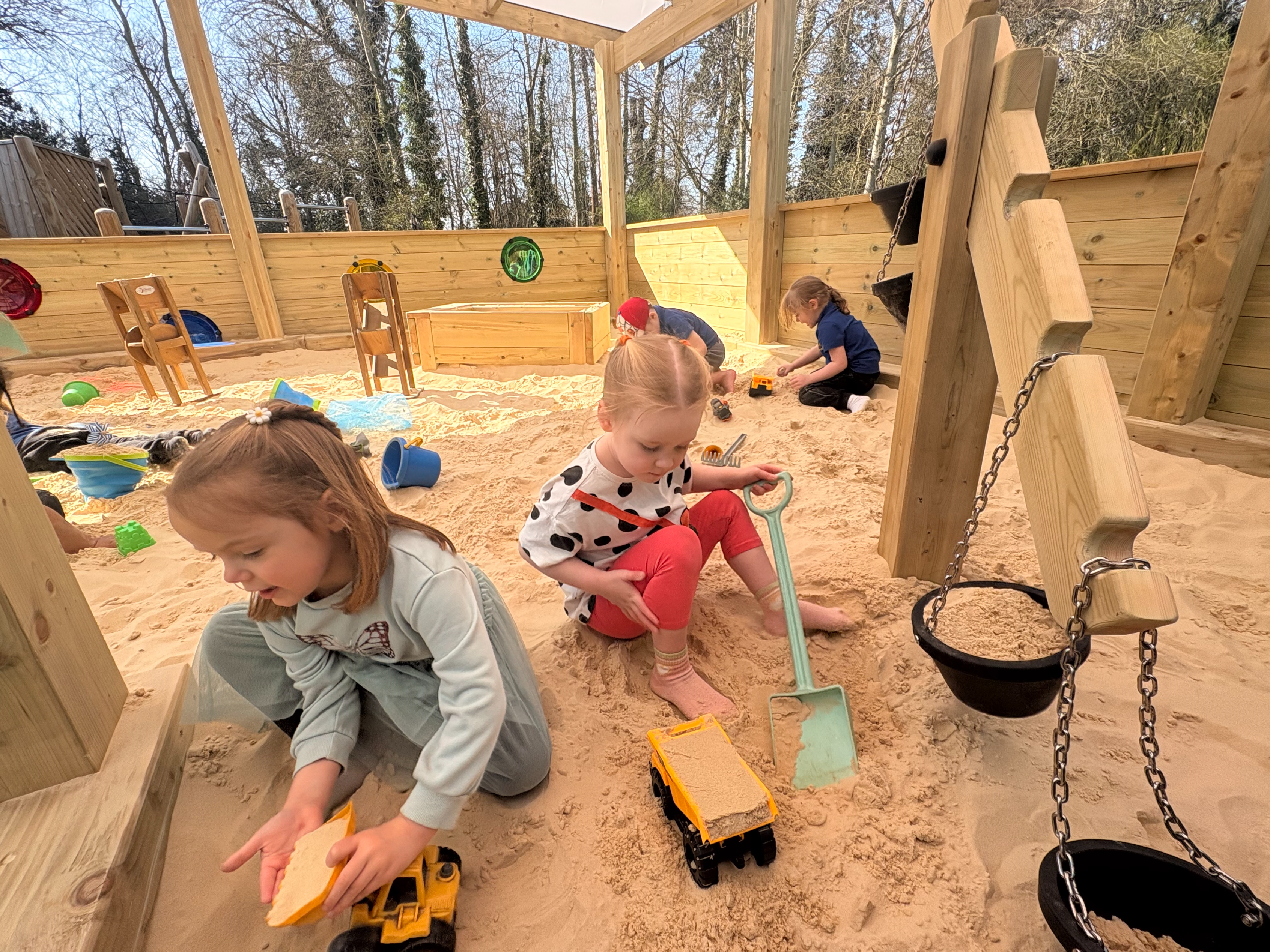 Canopy with Coloured Roof Panels covering Sand Play environment: Orton Longueville Playgroup