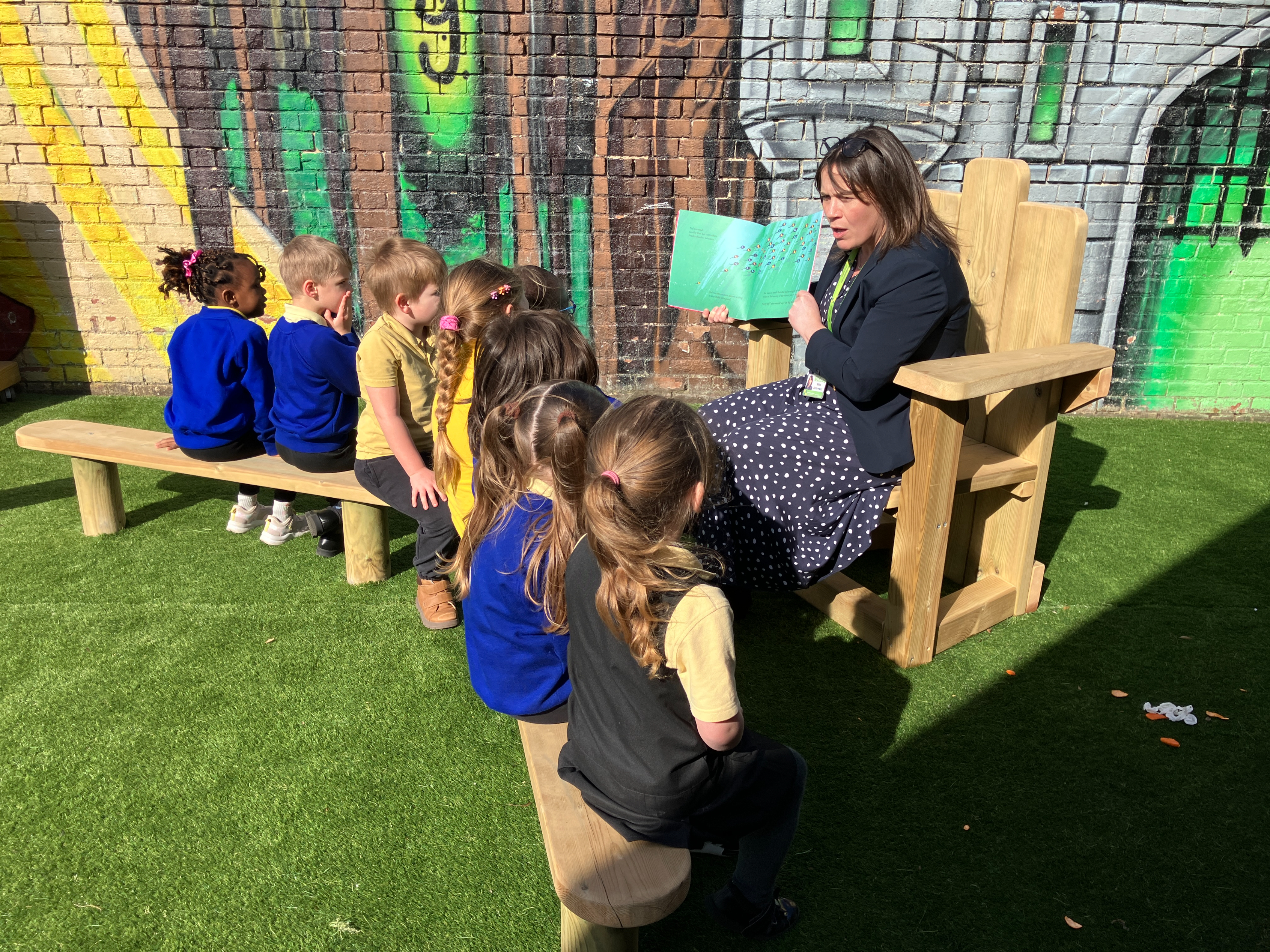 Communication & Language Development: storytelling chair and bench installation at Henderson Green Primary Academy