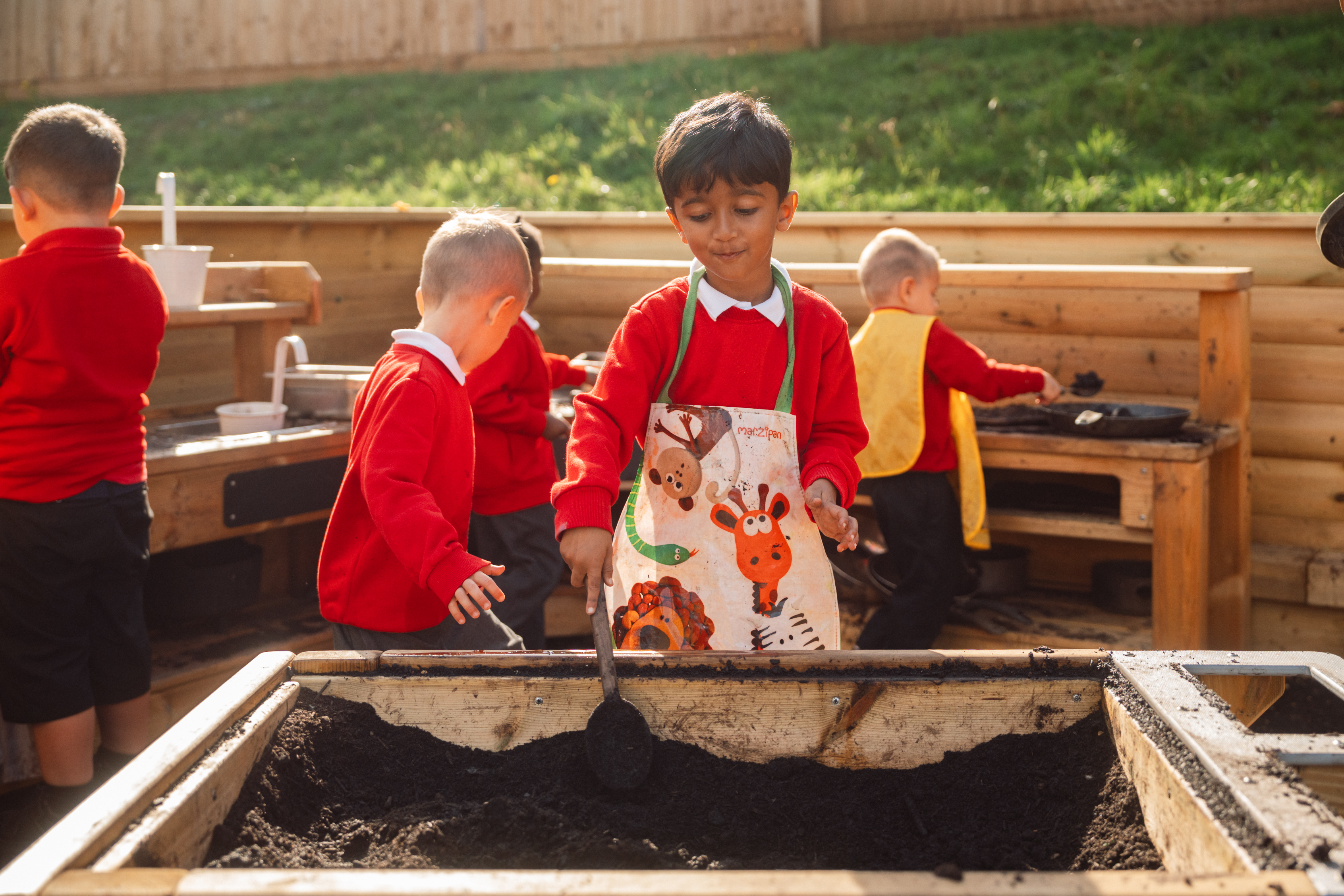 Hunsbury Park play development children playing with mud box