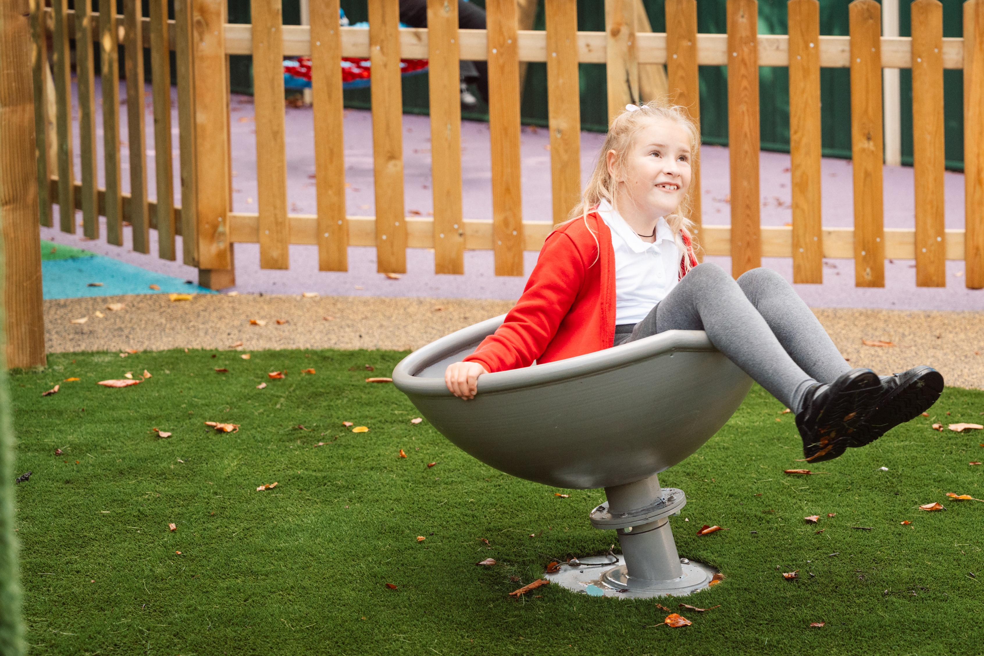 Hunsbury Park play development child playing on spinner